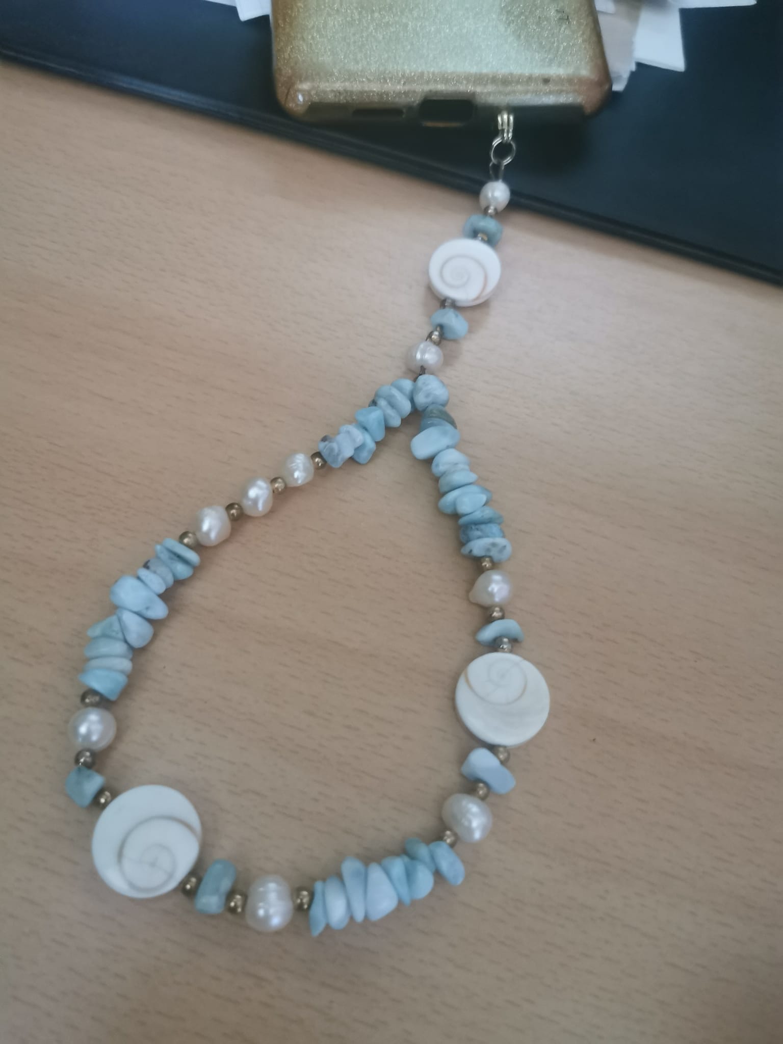 Bijoux de portable en Larimar et oeil de st Luçie-