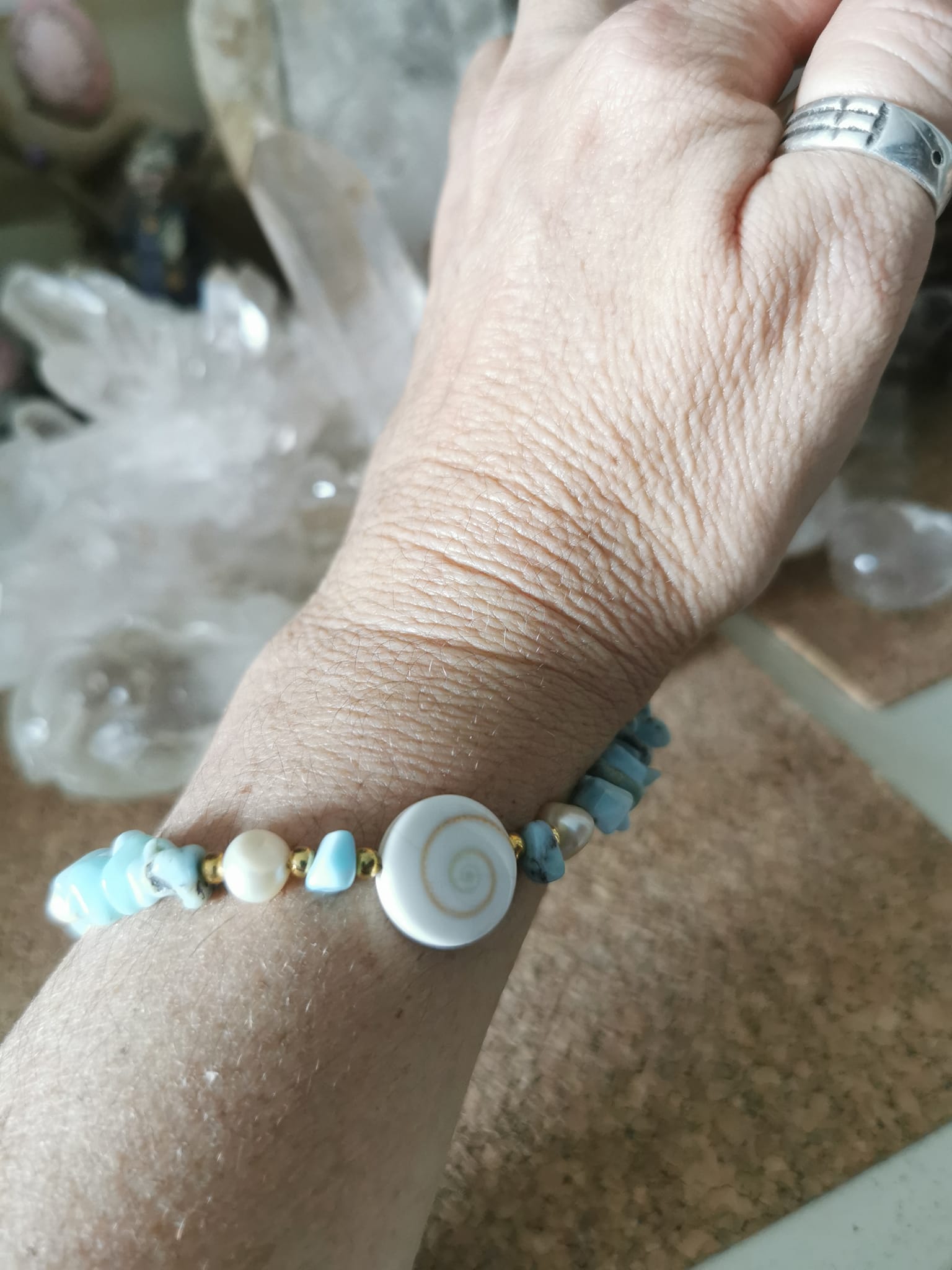 Bijoux de portable en Larimar et oeil de st Luçie---