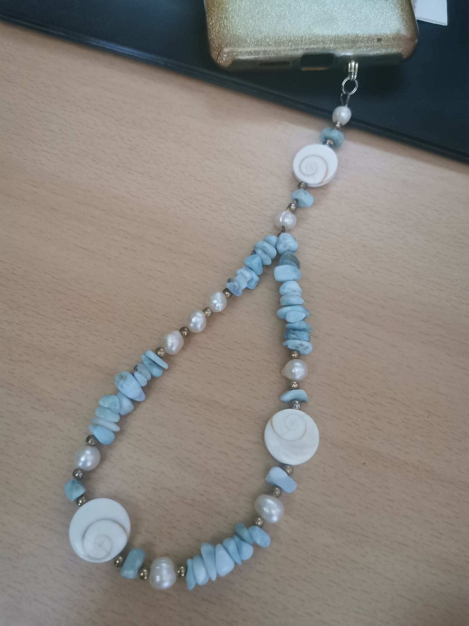 Bijoux de portable en Larimar et oeil de st Luçie...